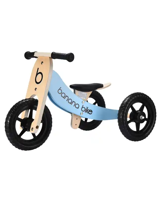 A light blue and wooden balance bike with three wheels, ideal for developing balance and coordination, perfect for Montessori toys for 1 year olds.