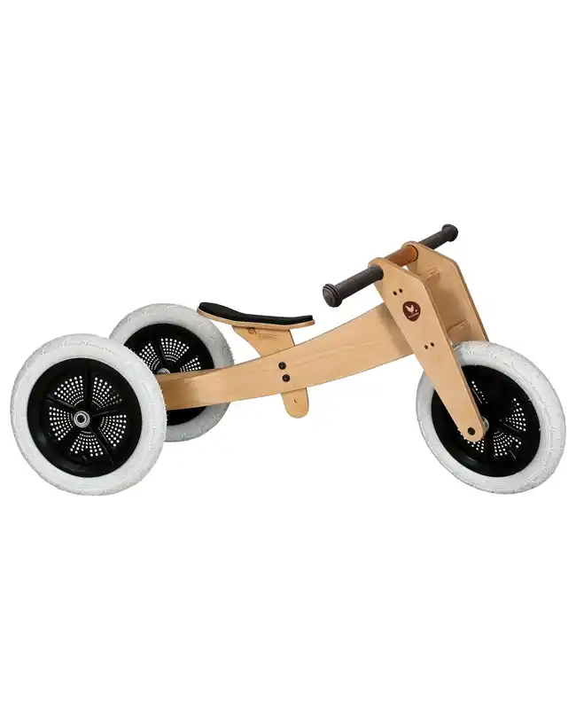 A wooden Montessori balance bike designed for 2-year-olds, promoting physical development and coordination.