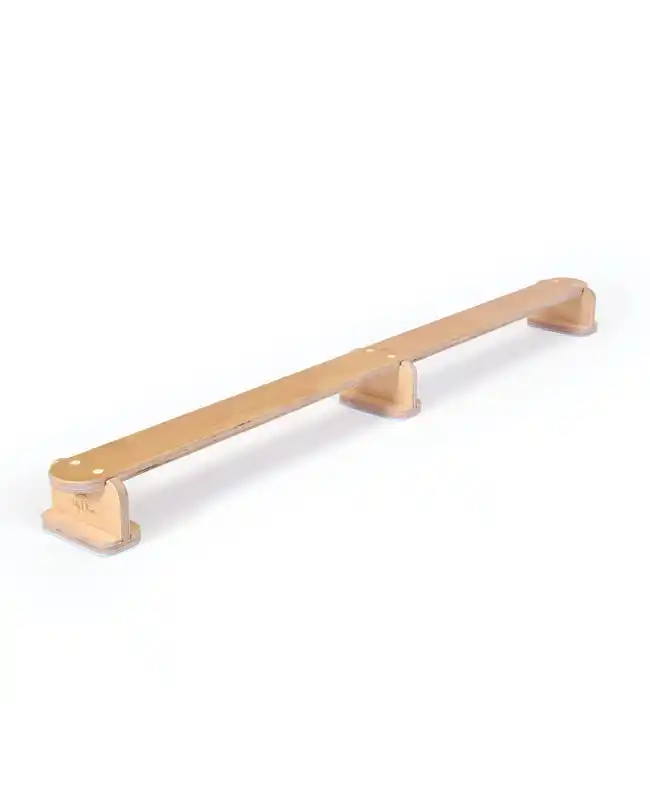 A wooden Montessori balance beam for 2-year-olds, designed to improve coordination and balance.