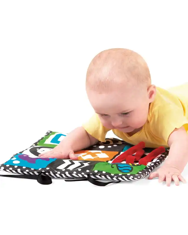 A baby exploring the Manhattan Toy Wimmer-Ferguson Crawl & Discover Mat during tummy time, featuring high-contrast images and textures.