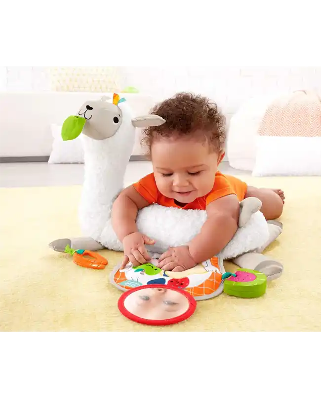 A baby playing with a Fisher-Price Grow-with-Me Tummy Time Plush Llama, a fun tummy time toy for infants.