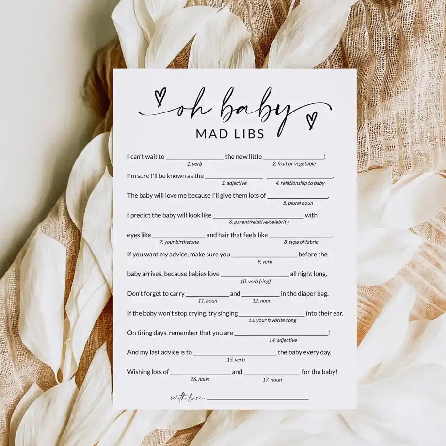 Baby shower game card titled 'Oh Baby Mad Libs,' surrounded by neutral-toned decor, perfect for adding fun to your celebration.