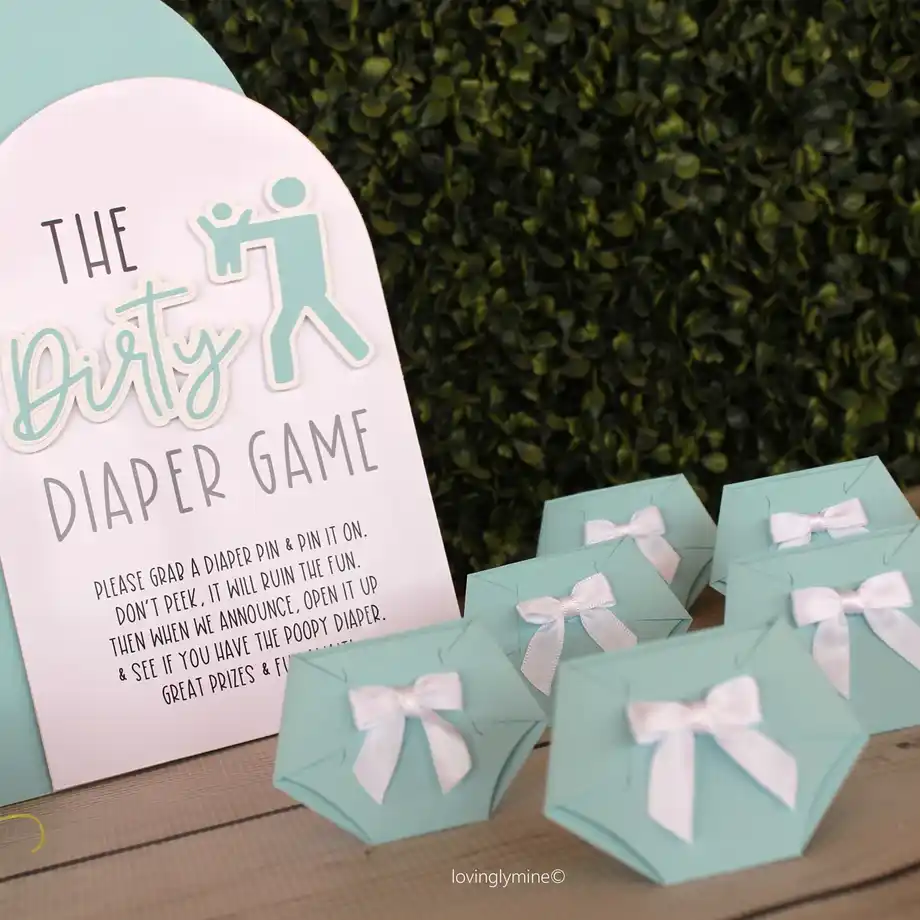 A stylish display for the Dirty Diaper Game, including mini diaper props and instructions for this hilarious baby shower game.