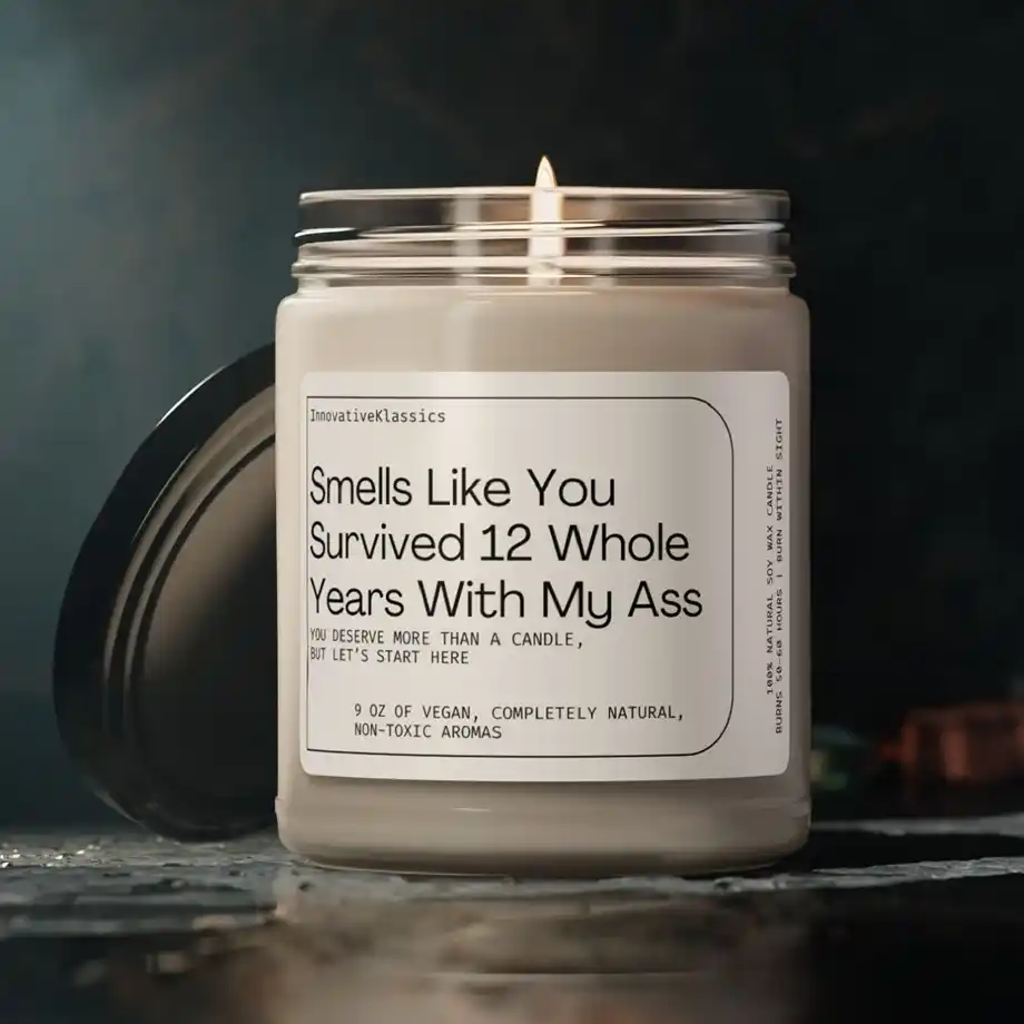 A humorous candle with the label 'Smells Like You Survived 12 Whole Years With My Ass,' perfect for a 12-Year Anniversary Gift.