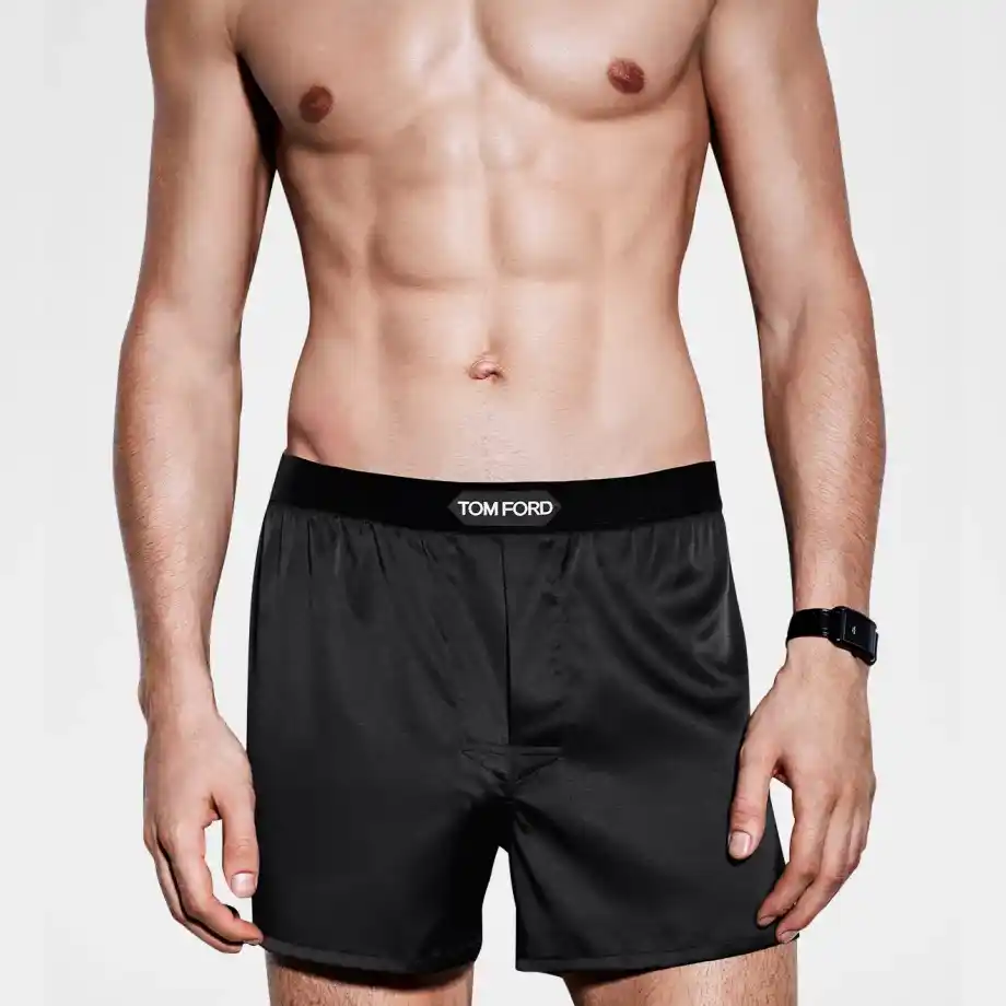 Elegant black silk boxers modeled, a luxurious and thoughtful 12-Year Anniversary Gift idea for him.