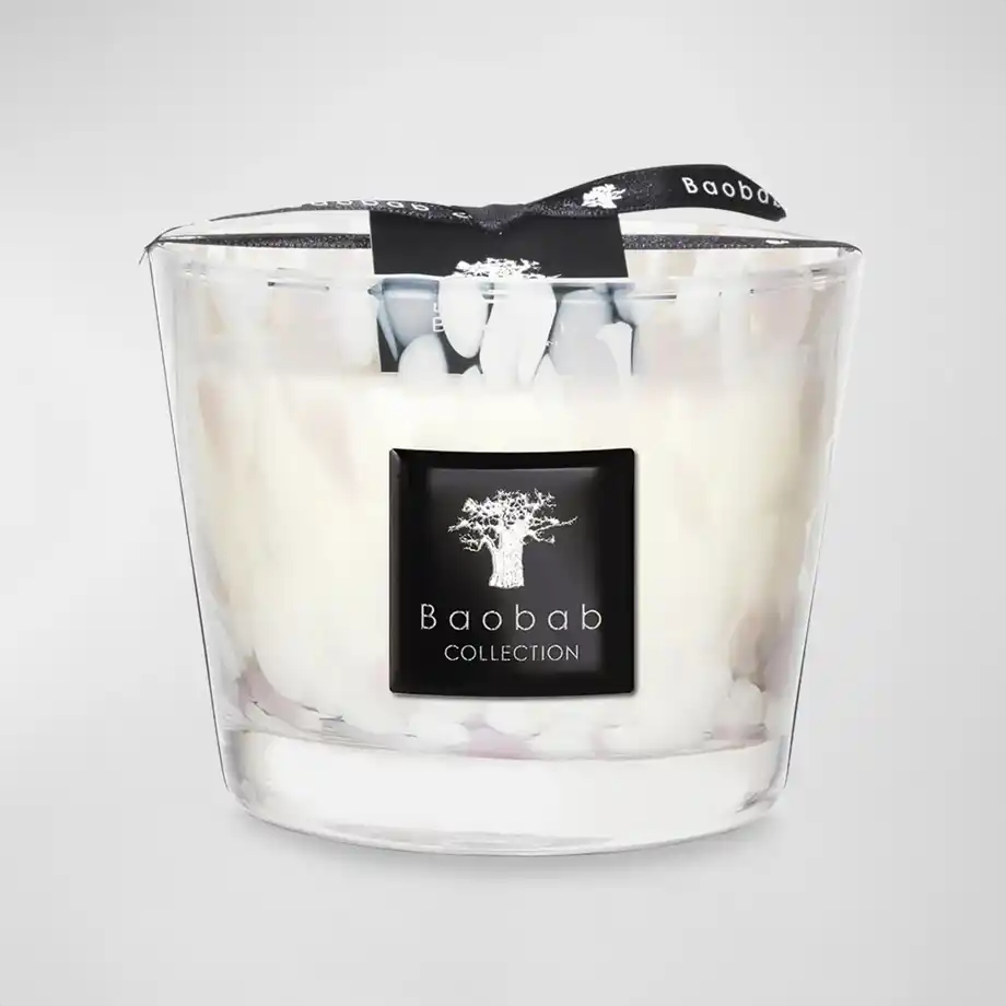 A Baobab Collection luxury candle in an elegant glass jar, a refined 12-year anniversary gift.