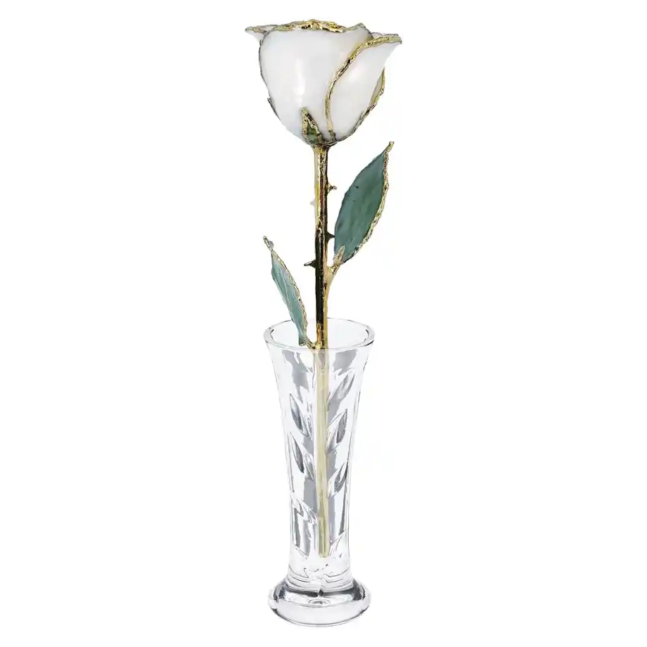 A white enamel rose with gold accents displayed in a crystal vase, a romantic and everlasting 12-year anniversary gift.