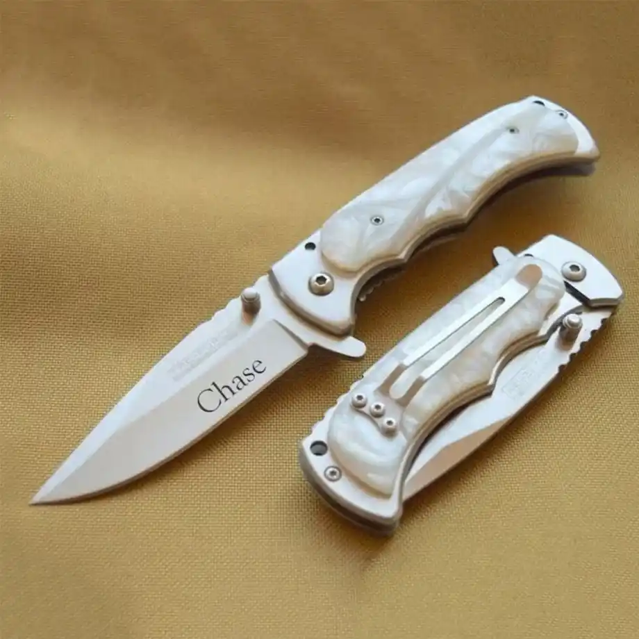 Elegant knife with a pearl handle engraved with a name, ideal for a 12-year anniversary gift.