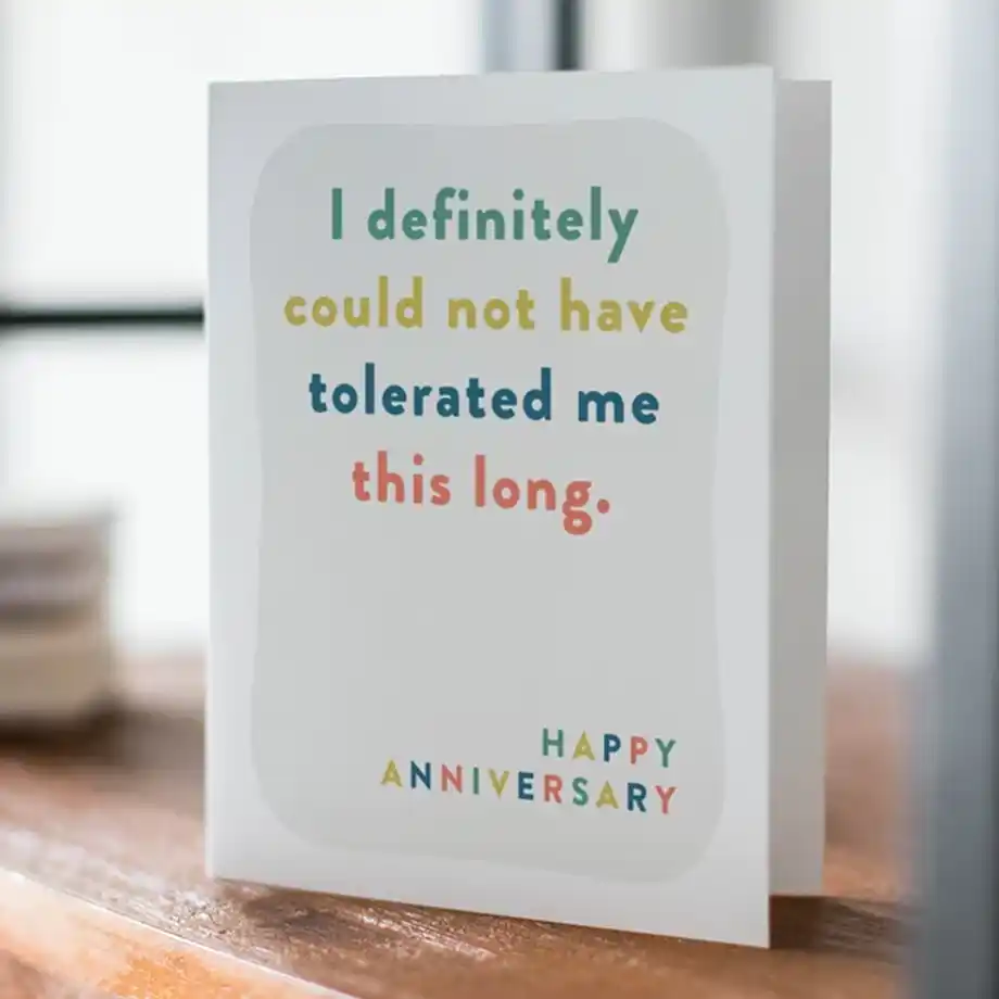 Humorous 'Thanks for Tolerating Me' anniversary card featuring funny and charming Anniversary Quotes for Wife, perfect for adding laughter to your special day.