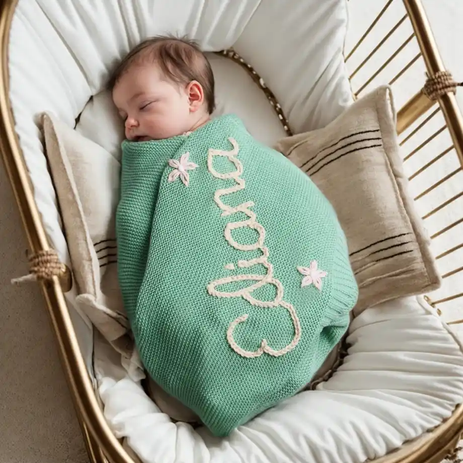 Soft, cozy personalized baby name blanket, hand-stitched for a unique and heartfelt baby shower gift idea. Perfect for wrapping newborns in warmth and love with a custom touch.