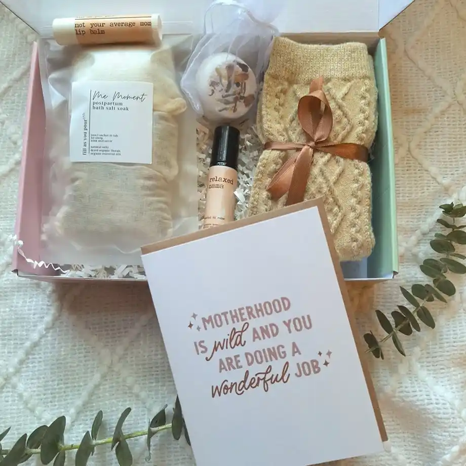 A beautifully curated postpartum care package featuring self-care essentials, ideal as a thoughtful baby shower gift for new moms. Includes soothing skincare items, recovery aids, and pampering treats to support postpartum recovery.