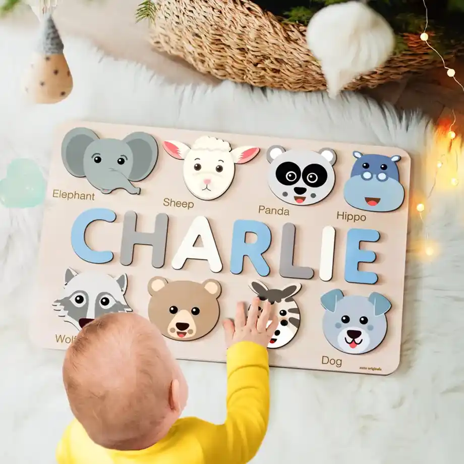 Personalized handmade name puzzle featuring adorable animal designs, a unique and fun baby shower gift idea. Crafted with care to help children learn and play while adding a personal touch to their nursery decor.