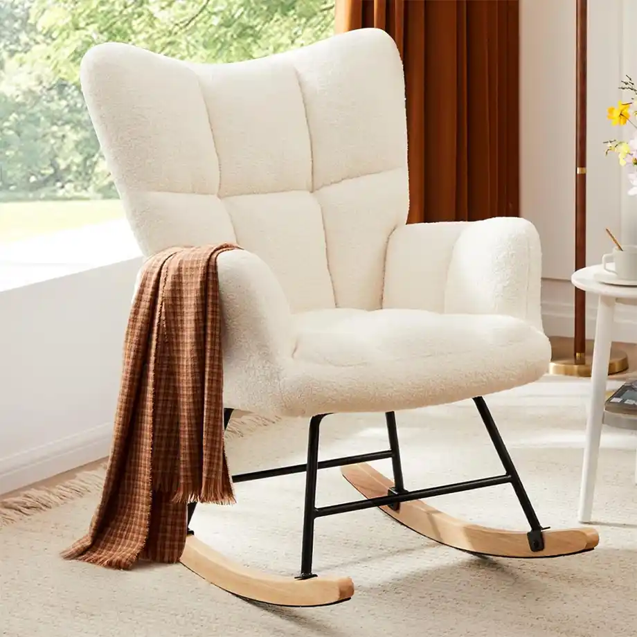 A stylish and comfortable rocking chair with a soft upholstered backrest, perfect for nursing or relaxing in the nursery. This elegant glider chair makes a thoughtful baby shower gift idea for new parents looking to add comfort and charm to their baby’s room.