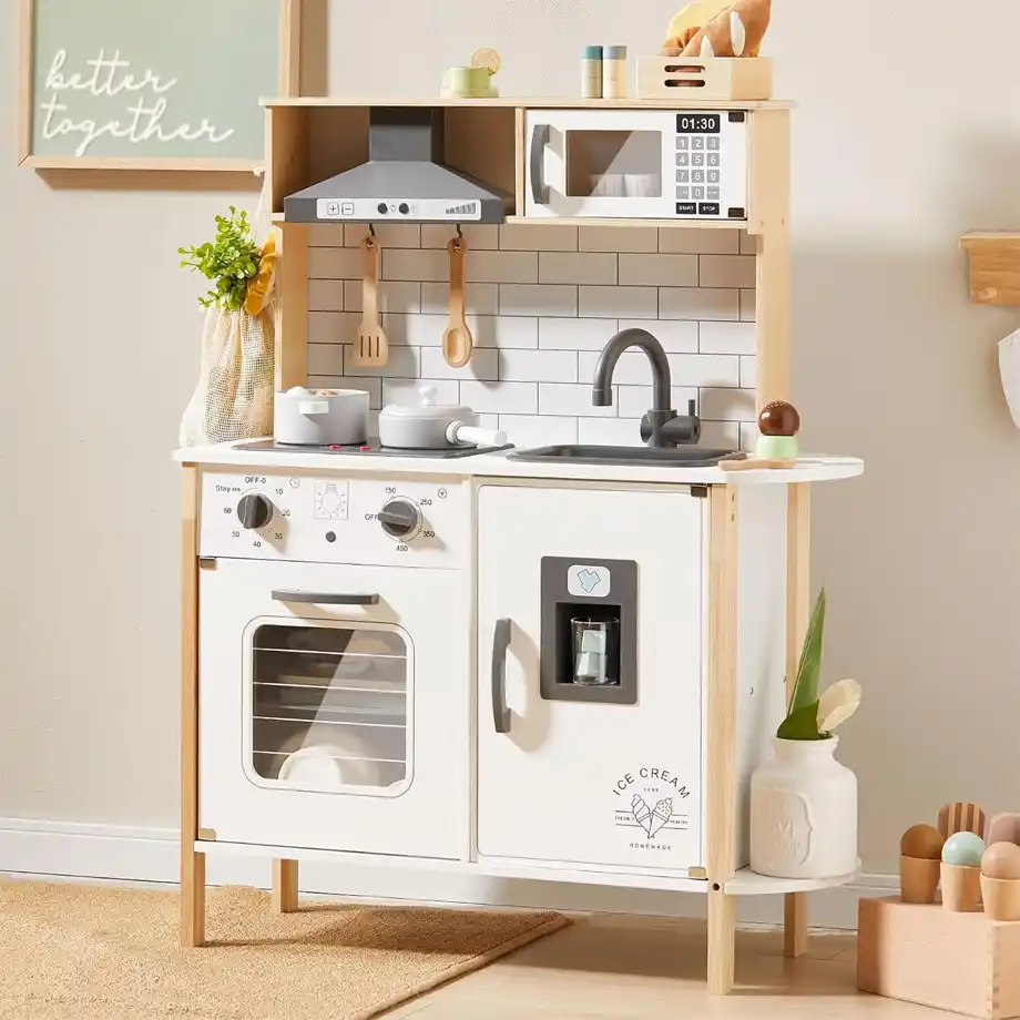 A modern wooden play kitchen set featuring a realistic oven, microwave, sink, and cooking utensils, designed as one of the best toys for 4-year-old boys to inspire imaginative play and creativity.