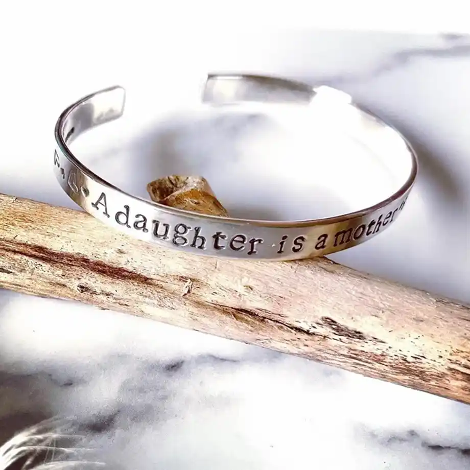 A custom silver cuff bracelet, the perfect personalized gift to express heartfelt Birthday Wishes for Daughter, making her special day even more memorable.