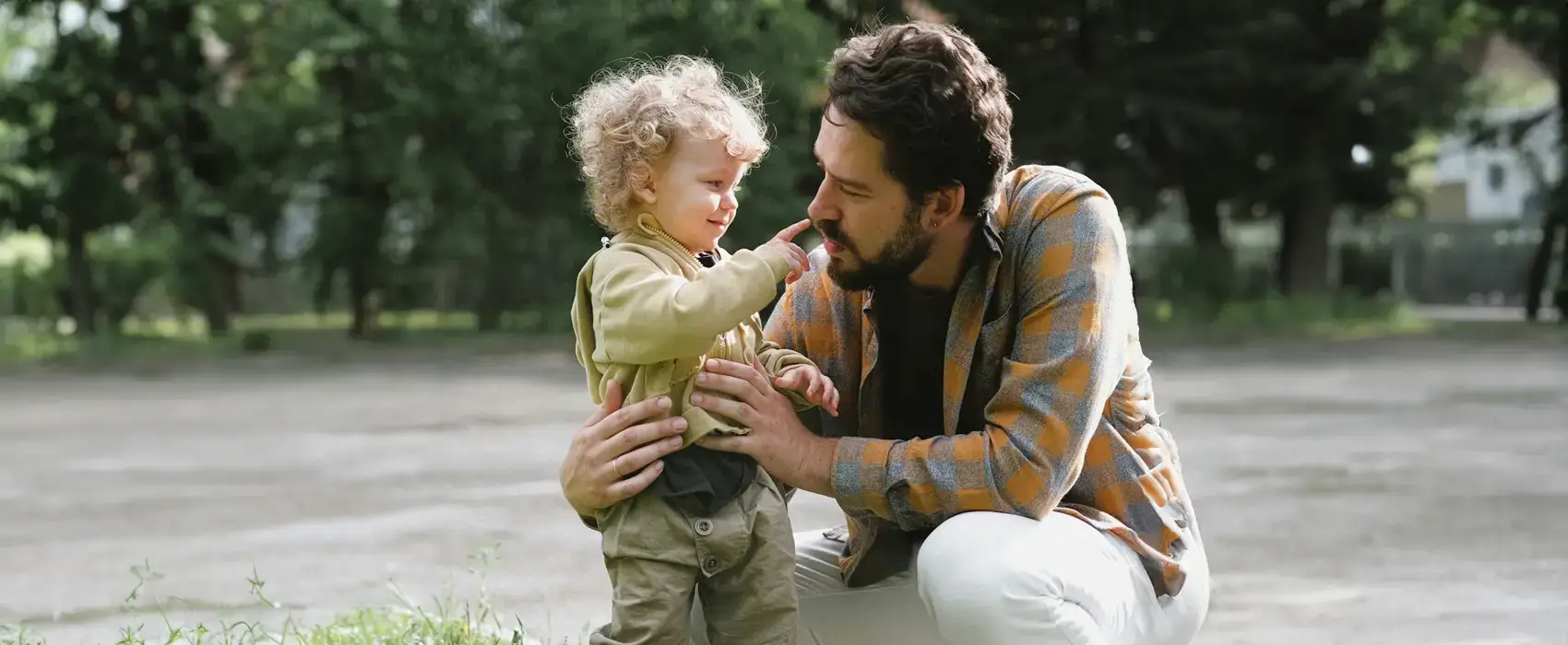 A heartfelt image of a father walking with his child in a serene outdoor setting, symbolizing the love, wisdom, and guidance reflected in meaningful Dad Quotes.