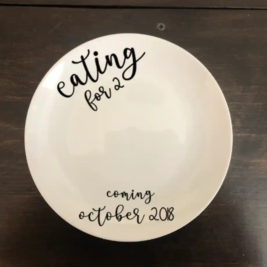 A charming 'Eating for Two' bowl, perfect for sharing your pregnancy news in a fun and memorable way, offering a unique twist on pregnancy announcement ideas for expecting parents.