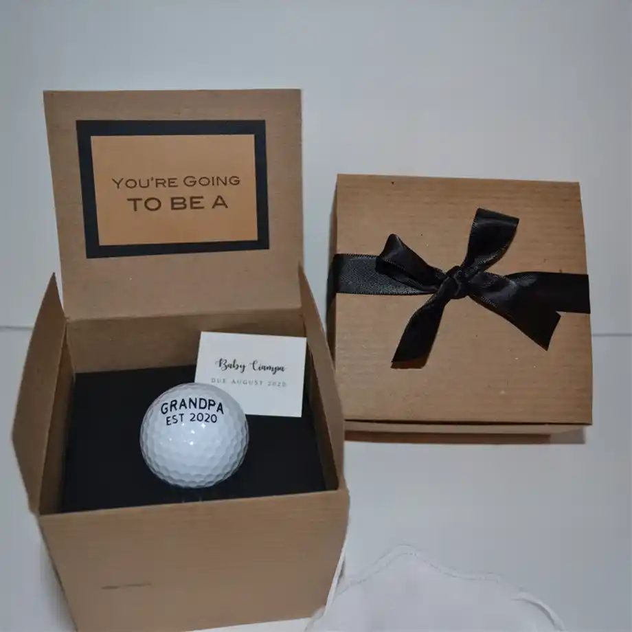 Reveal your pregnancy with a fun and unique twist using this golf-themed pregnancy announcement gift – a creative way to share your exciting news!