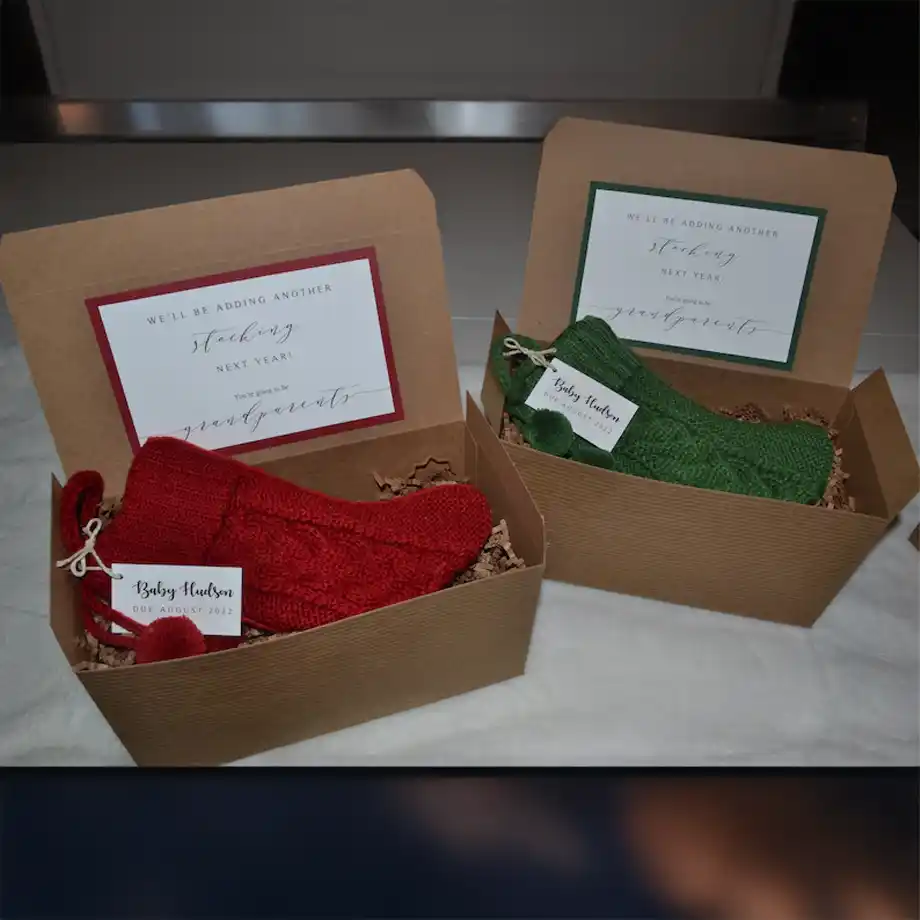 Beautifully crafted Christmas-themed pregnancy announcement gift box, featuring festive details and a heartfelt surprise inside. A perfect choice for memorable pregnancy announcement ideas during the holiday season.