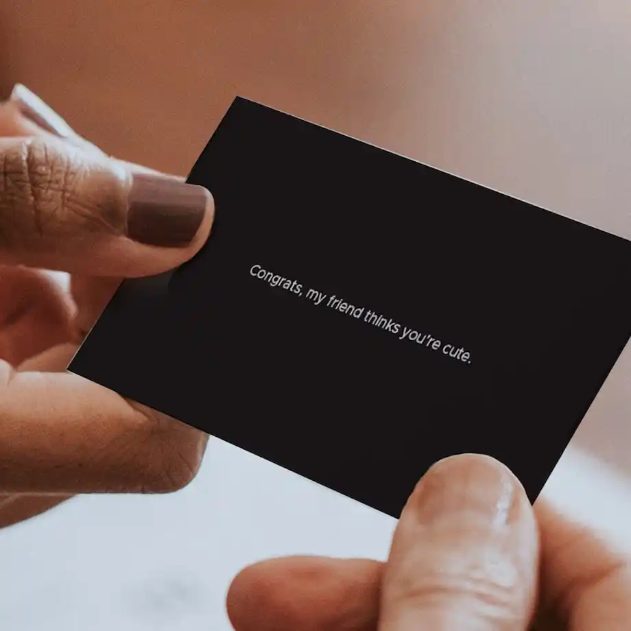 A playful and charming "Congrats, My Friend Thinks You're Cute" leave-behind business card with flirty Rizz lines, perfect for breaking the ice and leaving a memorable impression on your next date.