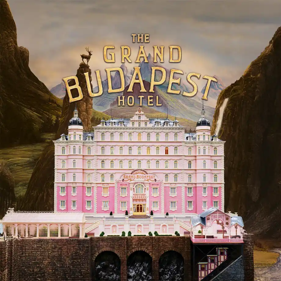 Movie poster for The Grand Budapest Hotel (2014), starring Ralph Fiennes, showcasing its unique, whimsical charm and colorful storytelling as one of the best comedy movies to enjoy.