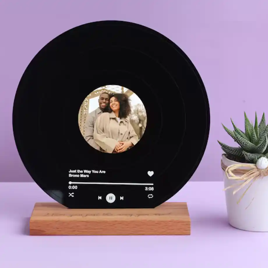 A stylish record display stand showcasing a favorite vinyl, perfect as a unique and sentimental gift to share birthday wishes for husband. Combines music and memories in a thoughtful design.