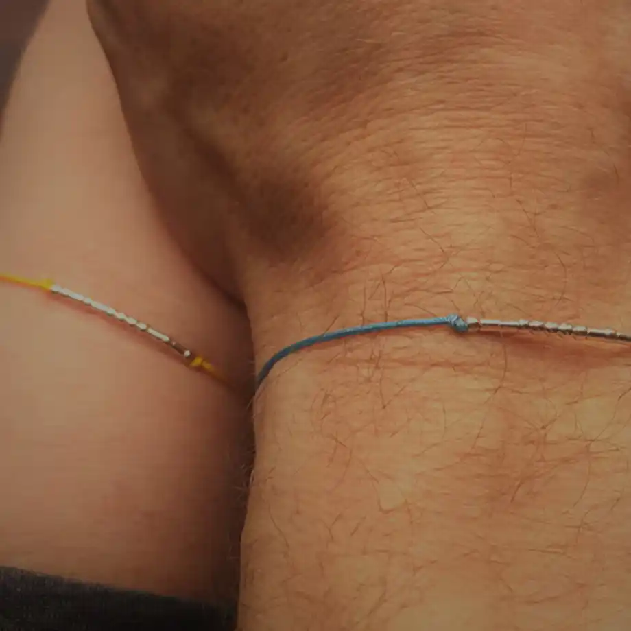 A pair of elegant morse code bracelets symbolizing a special message, perfect for sharing love and birthday wishes for husband. A subtle and meaningful gift for couples.