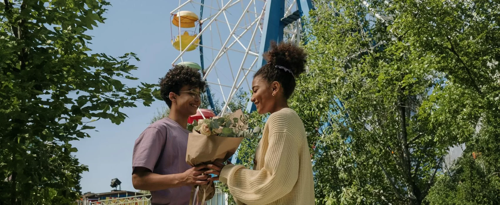 A young boy and girl enjoying a lively conversation at the fair, sparking exciting first date ideas. Their smiles and playful energy make the perfect setting for unforgettable moments