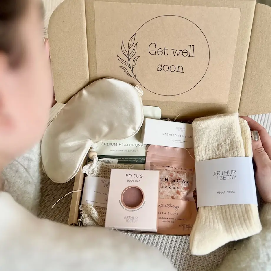 A thoughtfully designed Hug in a Box gift set, filled with cozy items and heartfelt touches to send a warm get well soon message