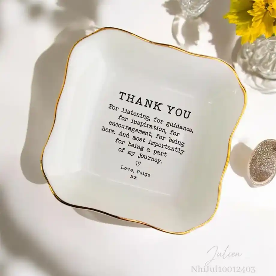 A small, elegant ring dish, perfect for holding rings, earrings, or small accessories. Customizable with names, initials, or designs for a personal touch.