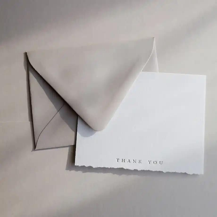 Sophisticated deckled edge thank you cards with luxurious foil-pressed details, perfect for expressing your heartfelt thank you message for gift-givers. These premium cards add a touch of elegance and charm to your gratitude, complete with matching envelopes for a polished presentation.