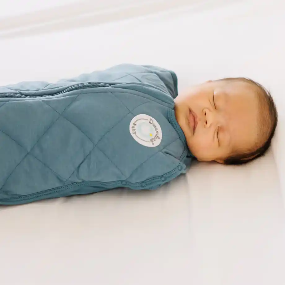 Dreamland Baby weighted sack swaddle in soft fabric, designed to provide gentle pressure and help soothe your baby during the witching hour, promoting better sleep and relaxation.