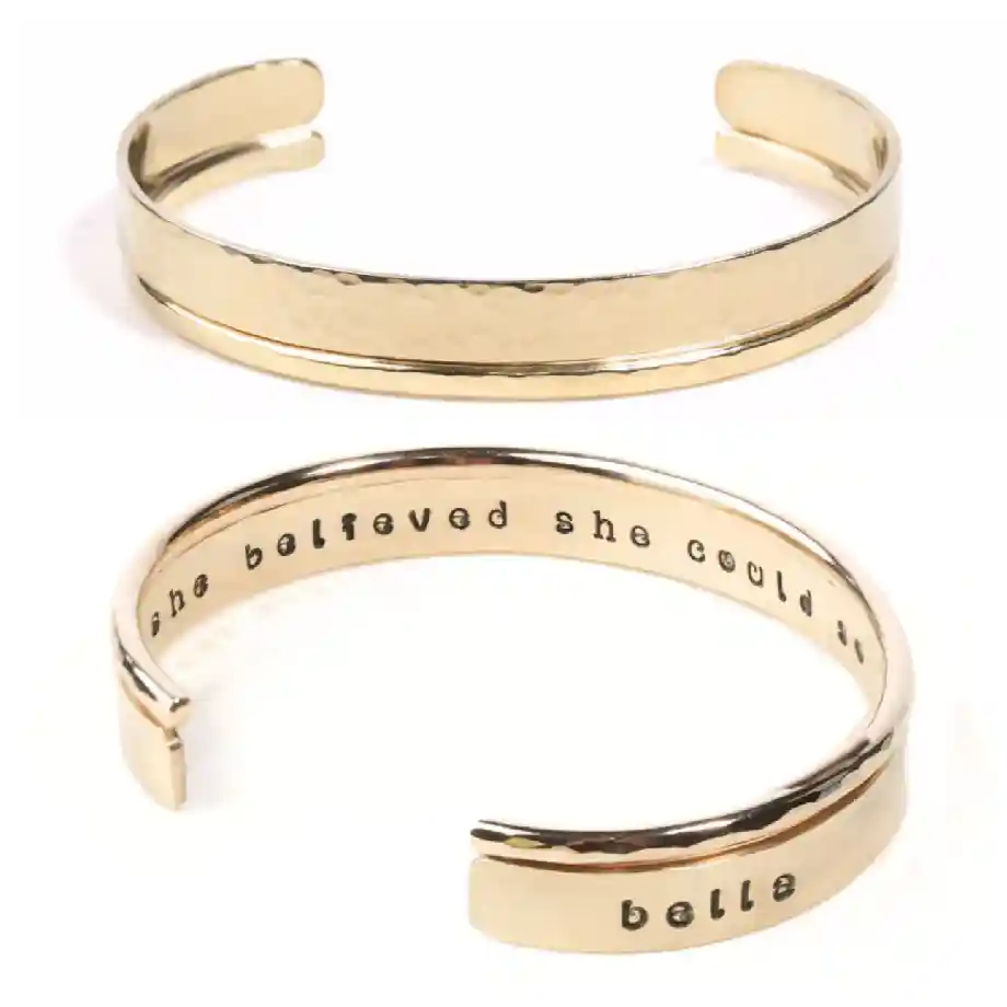 Elegant gold inspirational bracelet with the quote "She Believed She Could So She Did," a meaningful personalized graduation gift for her.