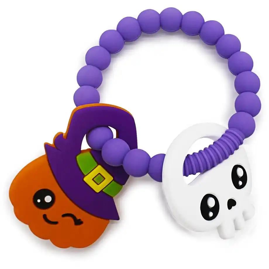 Adorable Halloween-themed baby teething toy with a purple beaded ring, featuring a smiling pumpkin with a witch hat and a cute skull, perfect for a festive boo basket gift.