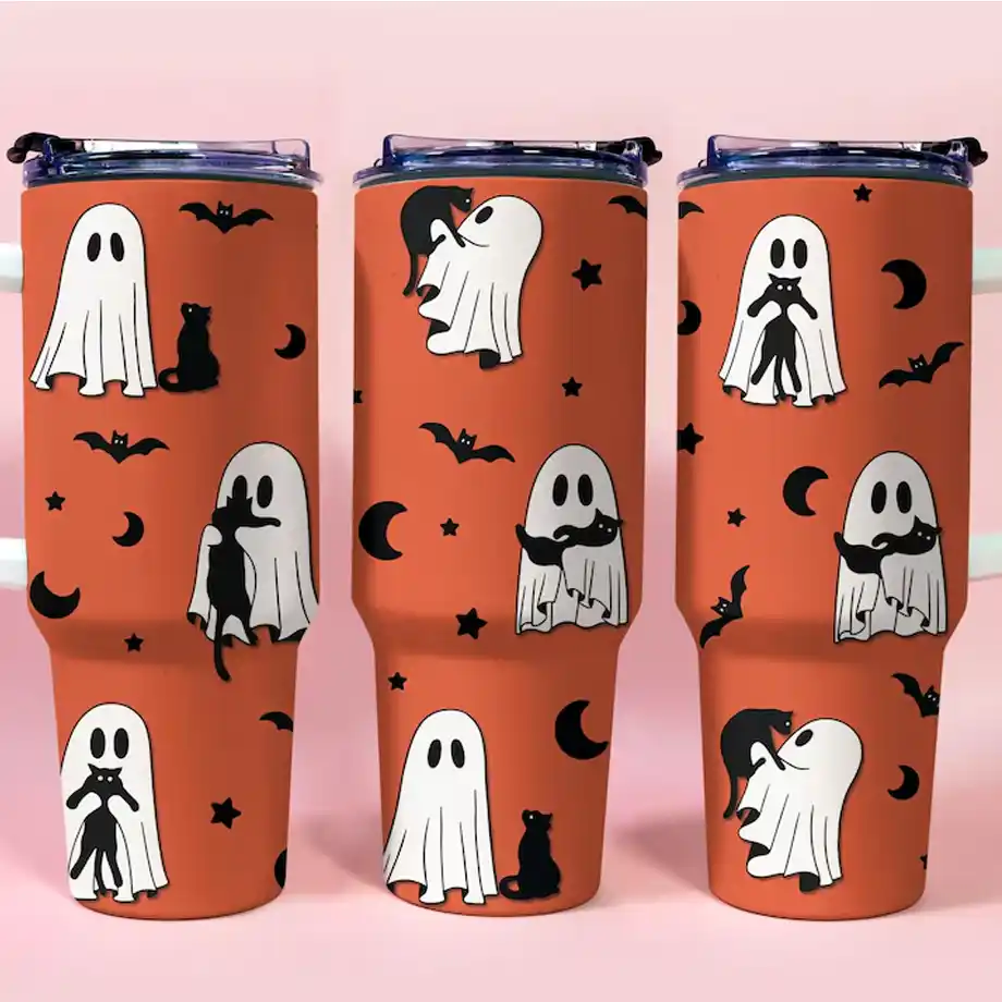 Three orange Halloween-themed tumblers featuring adorable ghosts and black cats, surrounded by bats, stars, and moons—perfect for adding a festive and spooky touch to your Halloween boo basket.