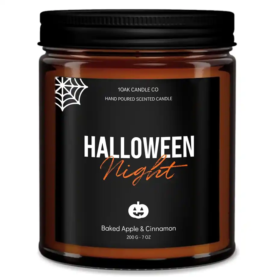 A 7oz Halloween-themed candle with a warm baked apple cinnamon scent, perfect for creating a cozy atmosphere or adding a spooky touch to a Halloween boo basket. A great gothic-inspired gift for women and men who love festive fall vibes and horror decor.