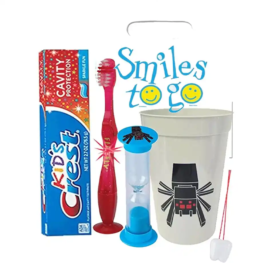 Colorful 4-piece Pixel Spider oral hygiene set with a light-up toothbrush, toothpaste, brushing timer, and mouthwash rinse cup — a playful and practical addition to a Halloween boo basket!