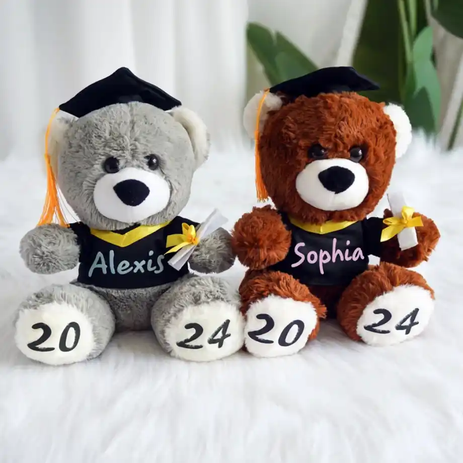 An adorable graduation-themed teddy bear, wearing a cap and gown, making it a cute and memorable graduation gift idea.