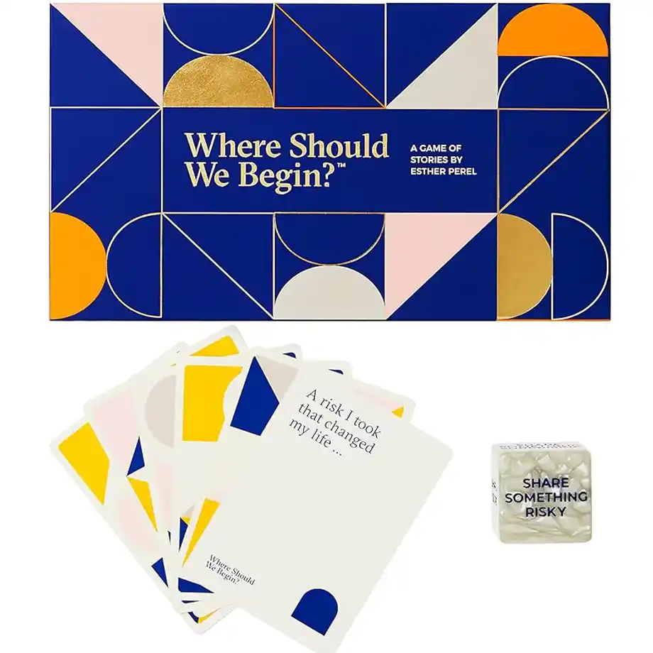 The 'Where Should We Begin?' card game by Esther Perel, featuring  storytelling prompt cards, and a dice with hot seat questions challenges.