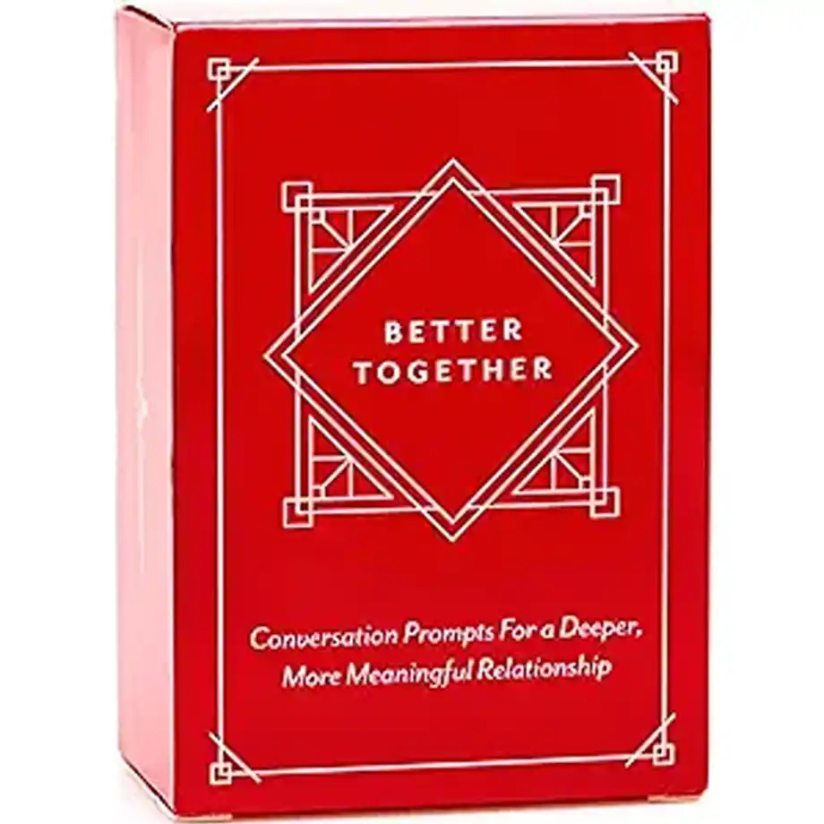 The 'Better Together' card game in a red box with conversation prompts featuring hot seat questions for couples to build a deeper, significant relationship.