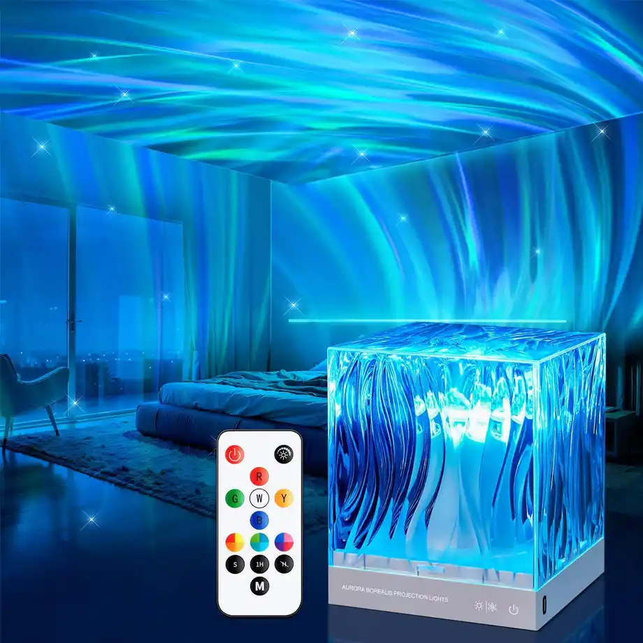 A mesmerizing Aurora Borealis projector light creating a stunning blue and green northern lights effect on the ceiling and walls of a modern bedroom. The cube-shaped projector comes with a remote control, making it a fun and relaxing addition to any space. A perfect choice for white elephant gift ideas that stand out.