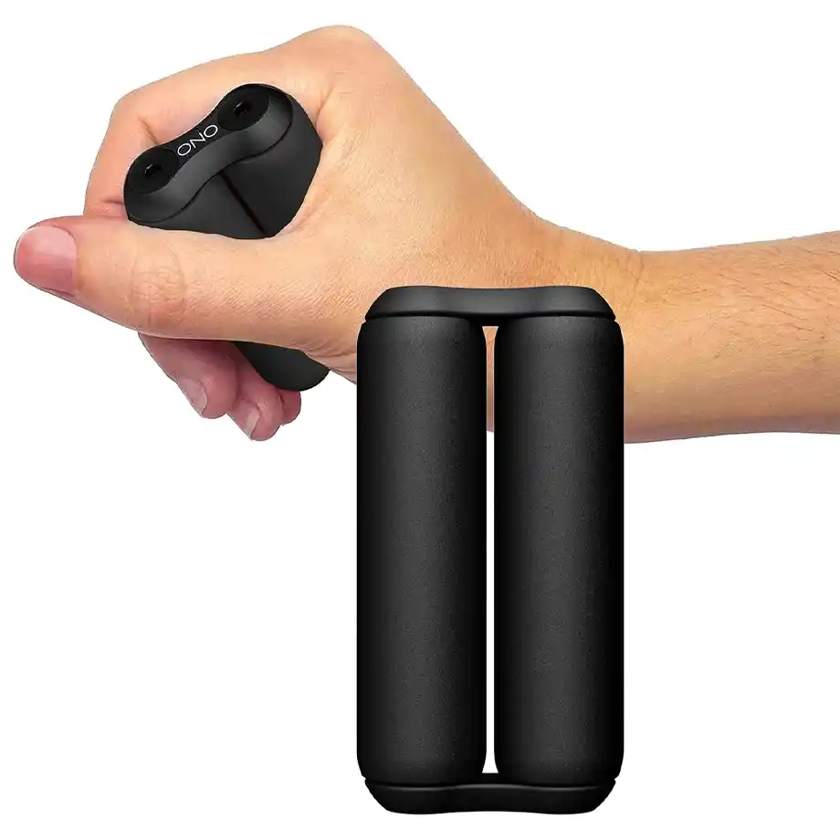 A black ONO roller fidget toy being held and squeezed in a hand, designed for stress relief and fidgeting. This sleek and compact gadget is perfect for office workers, students, or anyone who needs a calming distraction, making it a great choice for white elephant gift ideas.