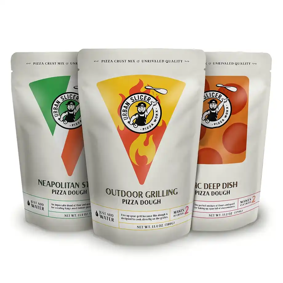 A set of three Urban Slicer pizza dough mixes, including Neapolitan Style, Outdoor Grilling, and Pan Deep Dish. A fun and delicious option for white elephant gift ideas, perfect for pizza lovers and home chefs.