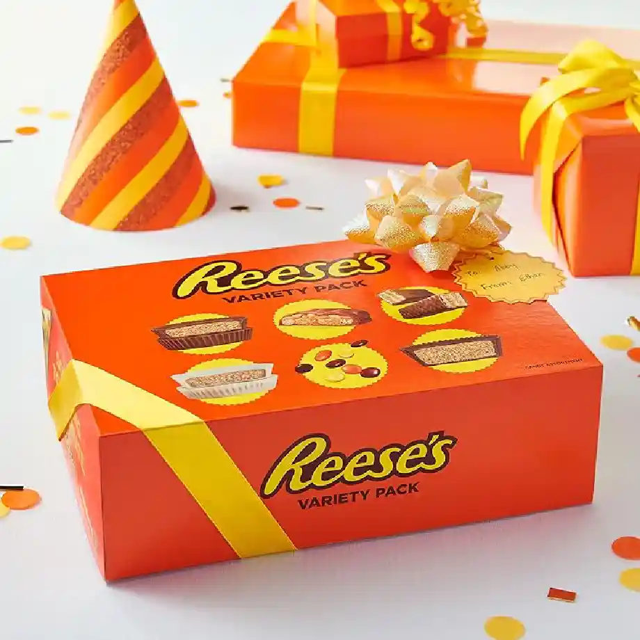 44.1 oz bulk box of REESE'S assorted peanut butter candy, featuring 30 delicious treats. A great gift idea for coworkers who enjoy indulging in chocolate and peanut butter snacks.