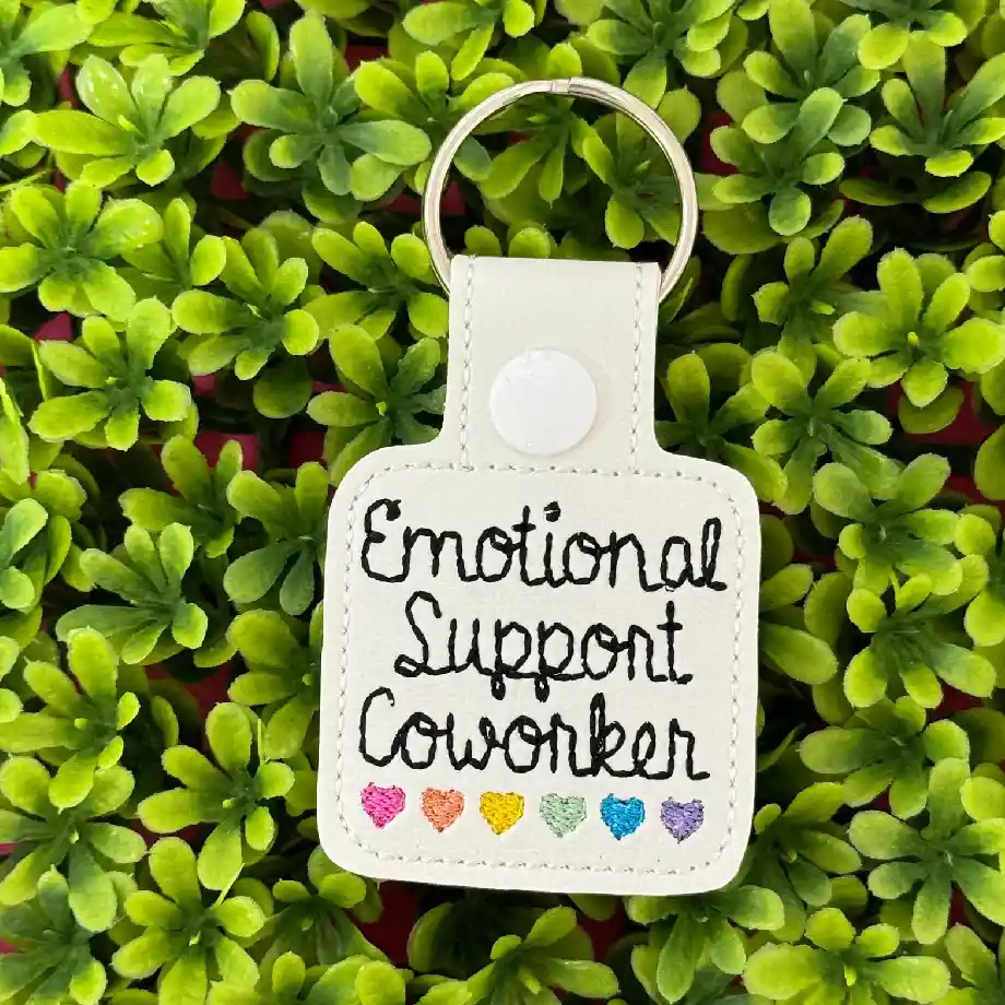 A stylish keychain with rainbow hearts, featuring "Emotional Support Coworker" text. A perfect appreciation gift for coworkers who always have your back.