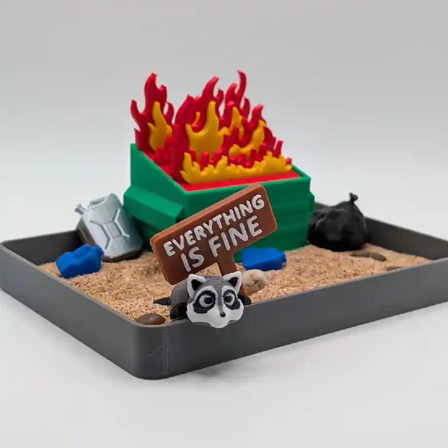 A funny Dumpster Fire Zen Garden, the perfect desk decor gift for coworkers who appreciate humor. A unique office decoration that adds a lighthearted touch to any workspace.