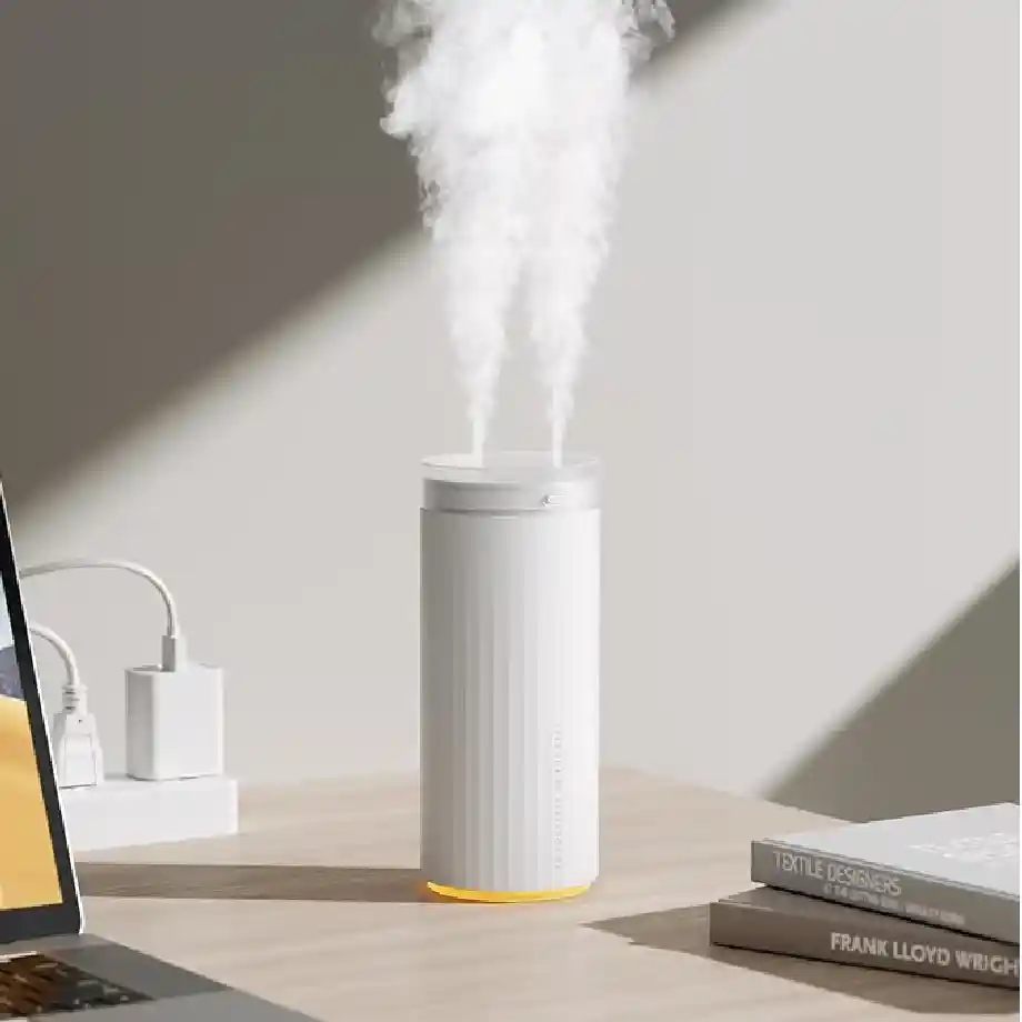 Compact 500ml portable humidifier with cool mist and auto shut-off, perfect for personal use in the office, home, or travel. A great gift idea for coworkers who appreciate a comfortable workspace.