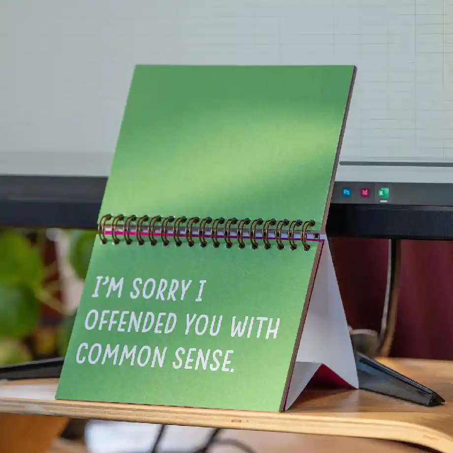 A funny and sassy desk companion featuring 24 pages of witty and sweary quotes—perfect for Secret Santa gifts, office decor, and adding humor to any workspace!