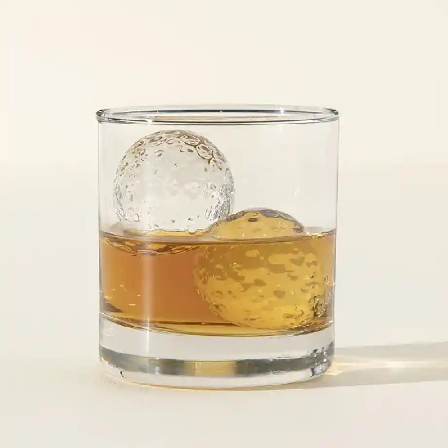 A set of two golf ball-shaped whiskey chillers designed to keep drinks cold without dilution. The perfect gift for golf lovers and whiskey enthusiasts, adding a unique touch to any bar. Ideal for Father's Day, birthdays, or as a stylish addition to a golfer’s collection.