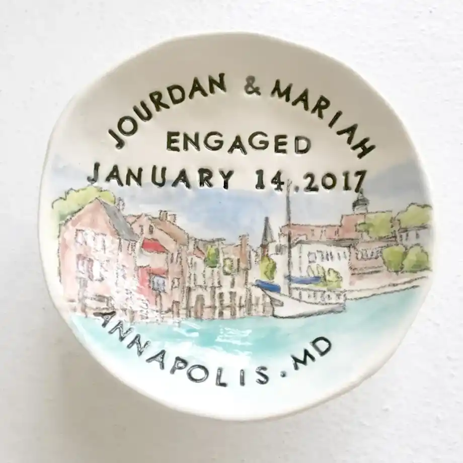 A custom ceramic ring dish featuring personalized engraving, perfect for safely storing engagement and wedding rings. A thoughtful and stylish addition to engagement gift ideas for newly engaged couples.